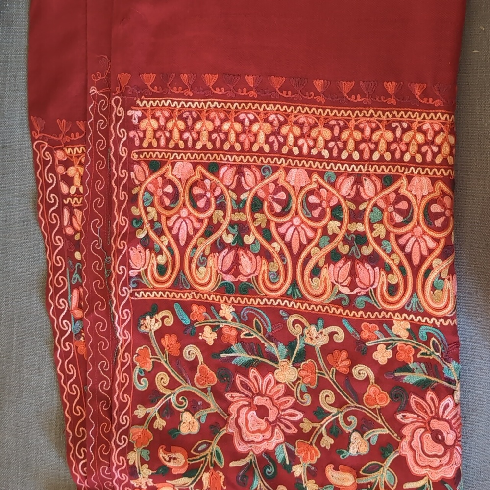 Intricately embroidered shawl with fringe